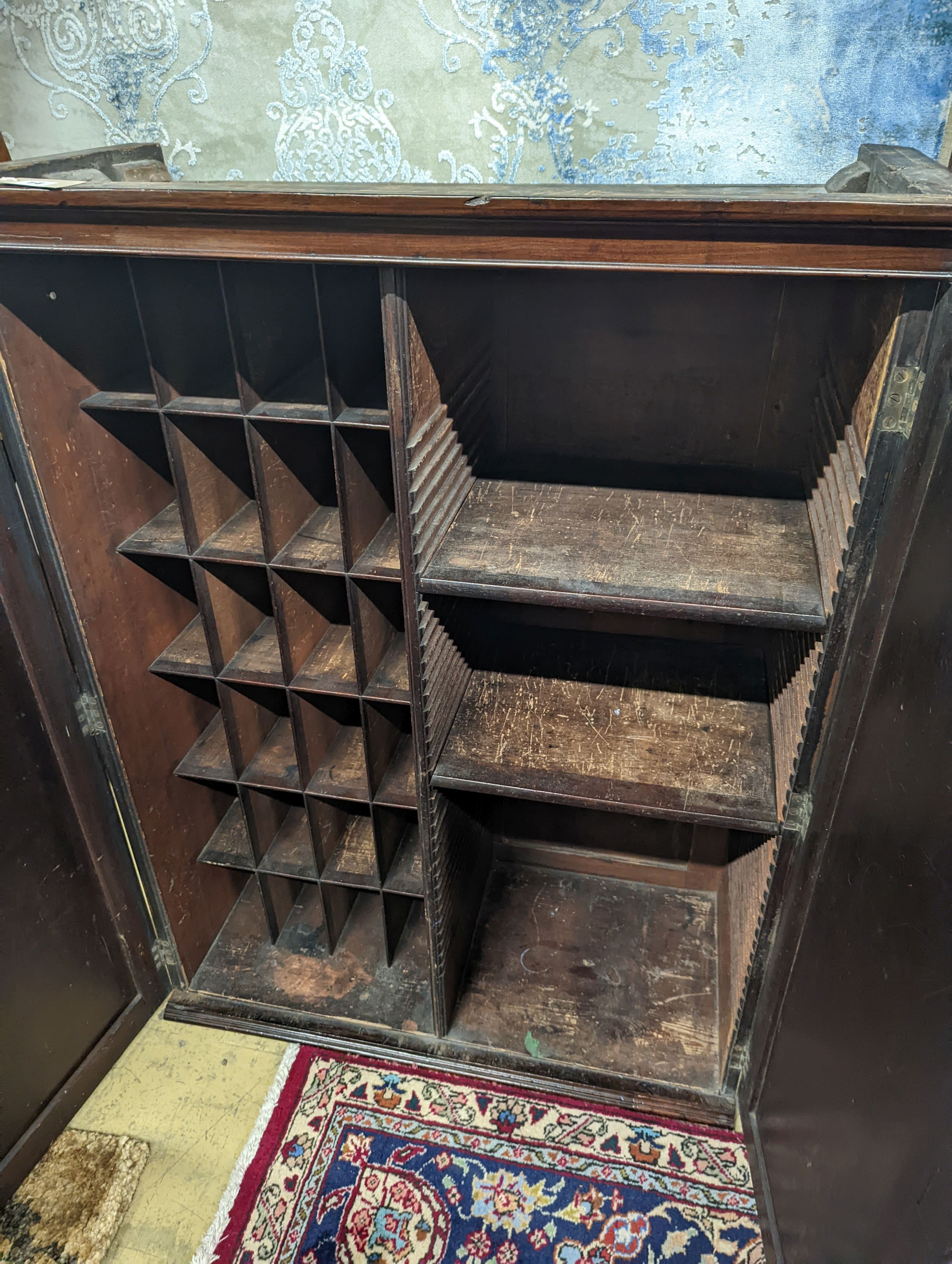 An early 19th century mahogany two door cabinet top section with pigeonhole interior, width 89cm, depth 42cm, height 113cm